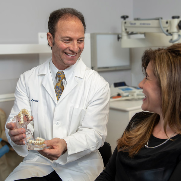doctor showing patient a model