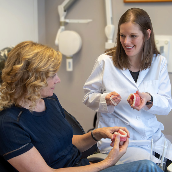 doctor showing patient invisalign