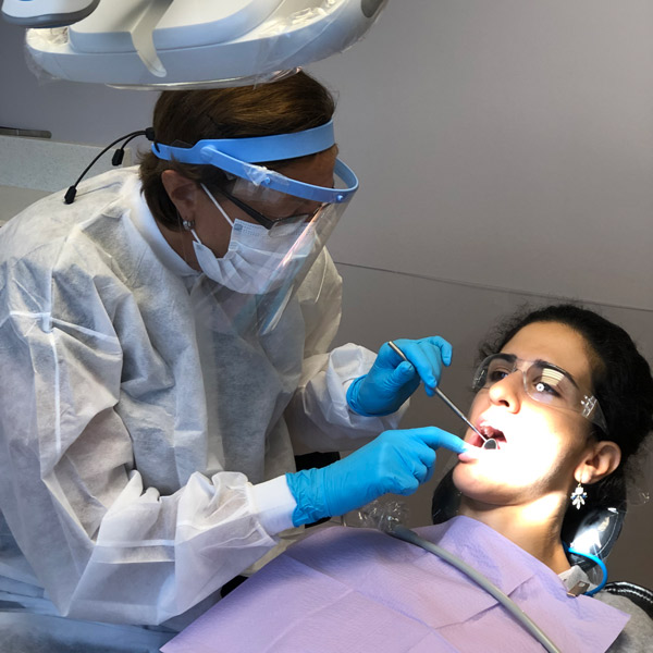 dental hygienist and patient